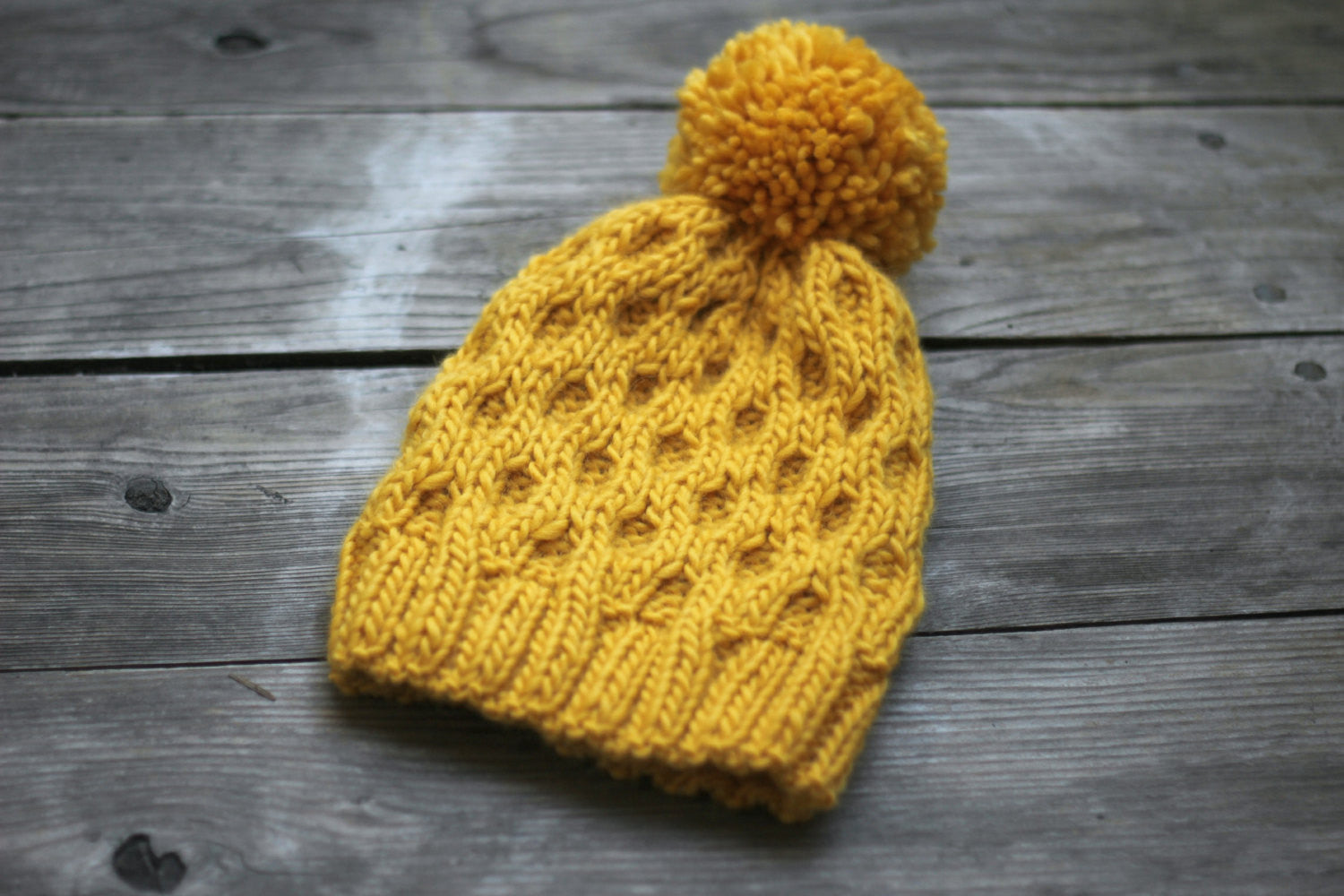 Knitted hat in mustard yellow color