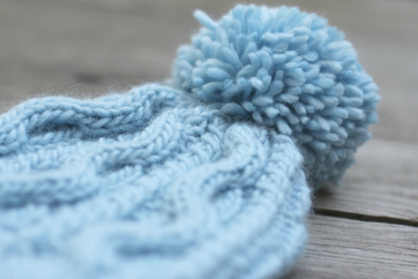 Blue hat with pompom