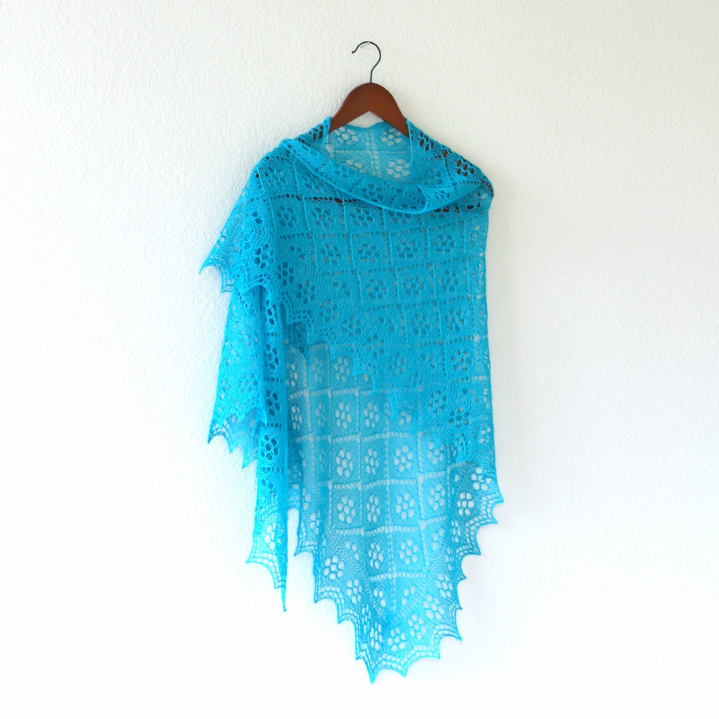 Knitted turquoise shawl