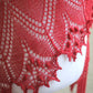 Knitted red shawl with nupps