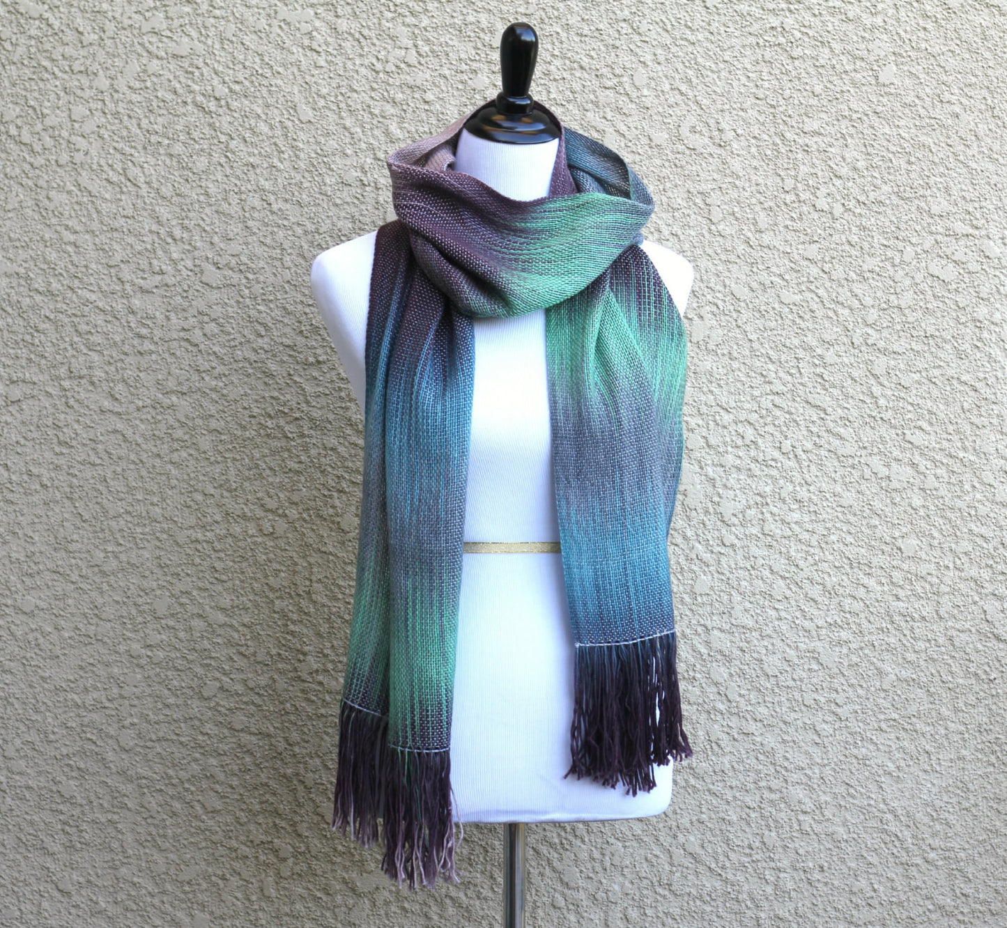 Woven scarf in green, blue and brown colors