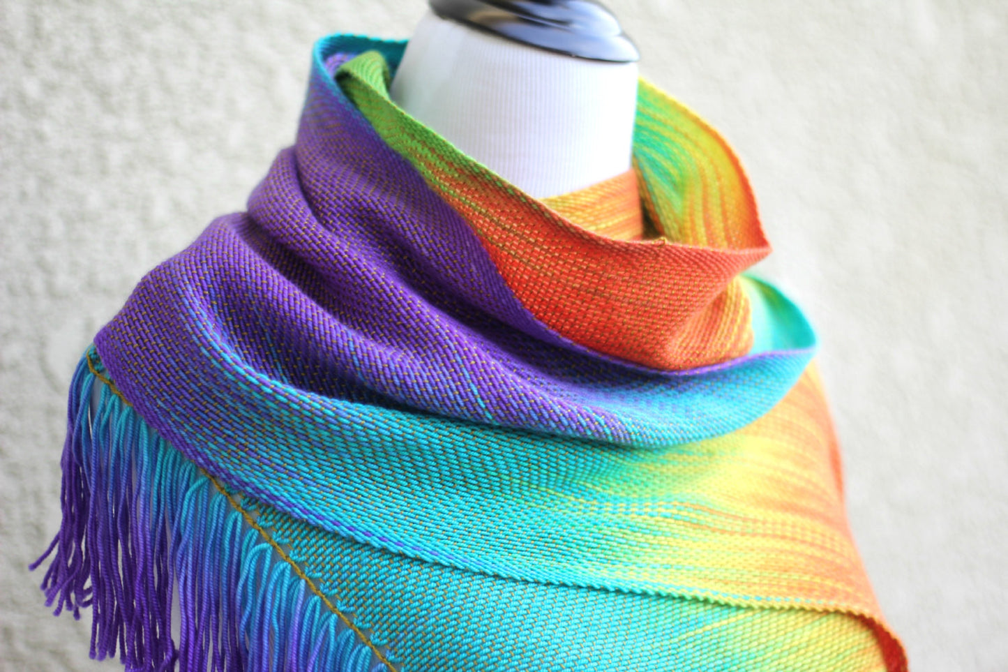 Woven rainbow scarf in red, green, yellow, turquoise and purple