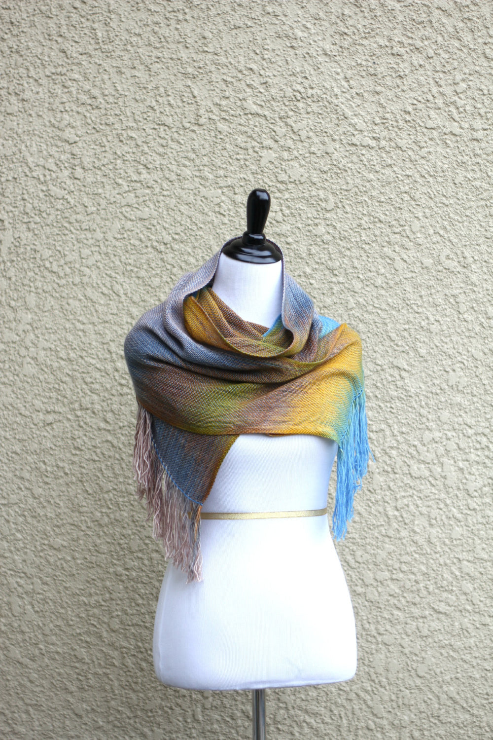 Woven scarf in yellow, blue and brown colors