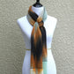 Hand woven scarf in white, orange, black and mint colors